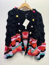 Gilet coloré avec pompons