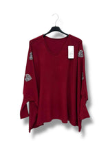 Pull oversize avec cœurs strass sur les manches