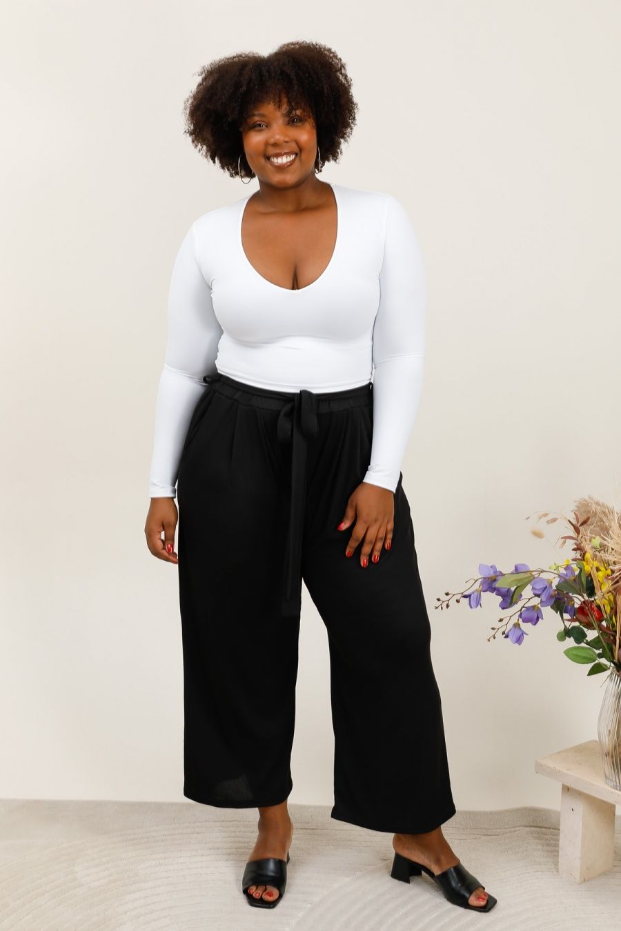 Pantalon noir texturé avec nœud à la taille