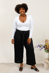 Pantalon noir texturé avec nœud à la taille