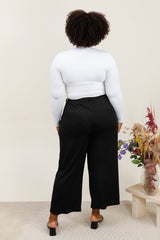 Pantalon noir texturé avec nœud à la taille