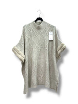 Poncho col montant