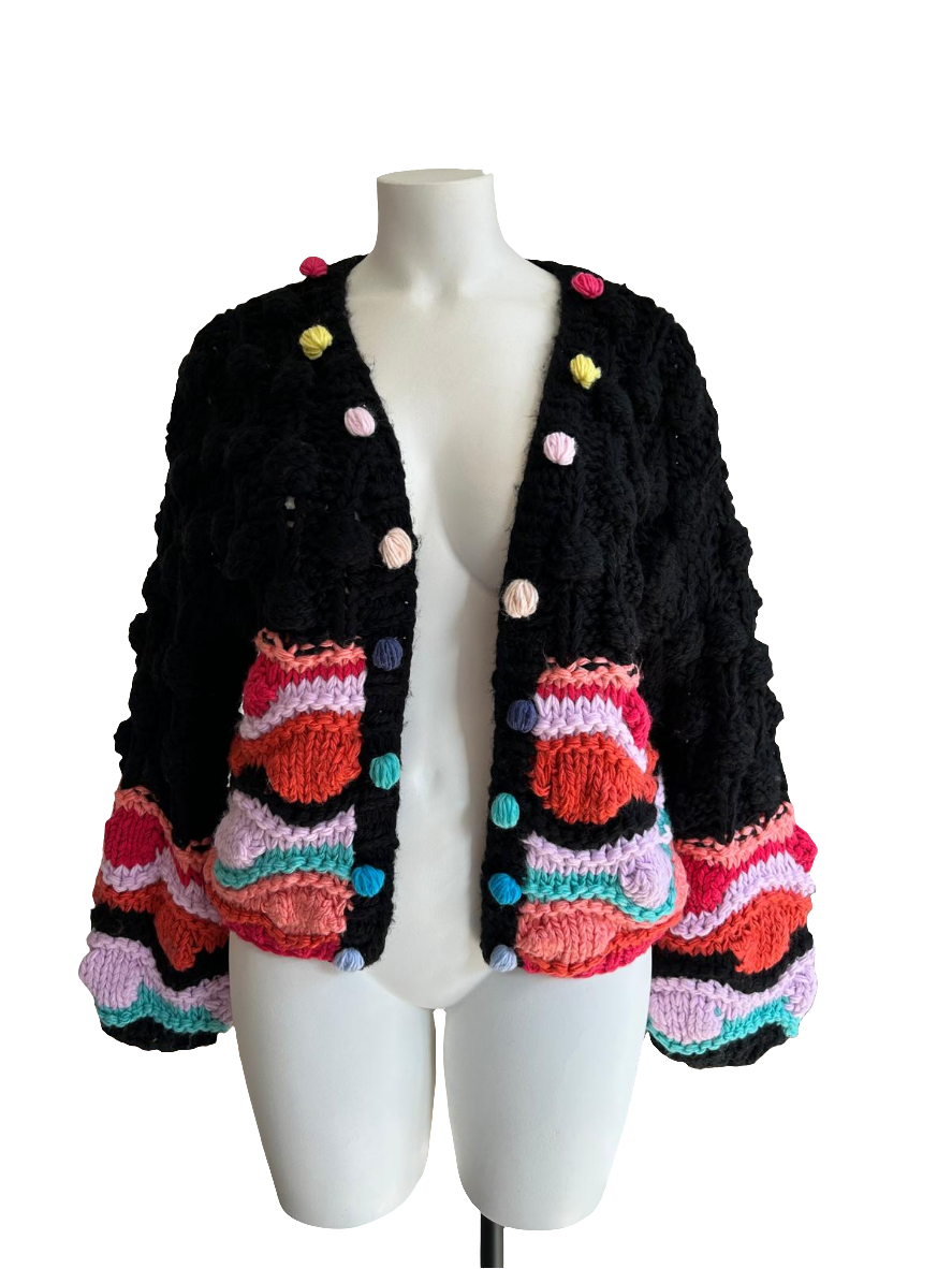 Gilet coloré avec pompons