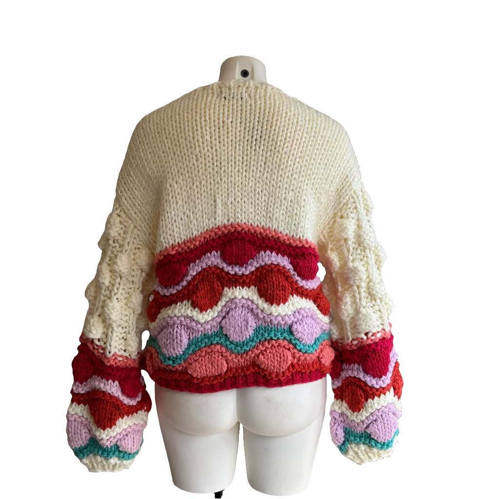 Gilet coloré avec pompons