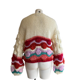 Gilet coloré avec pompons