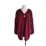 Tunique avec noeud et broche