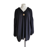 Tunique avec noeud et broche