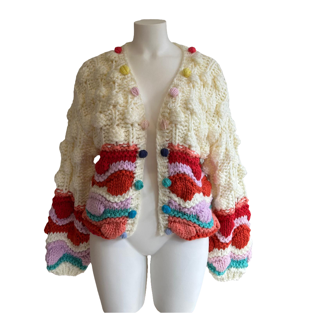 Gilet coloré avec pompons