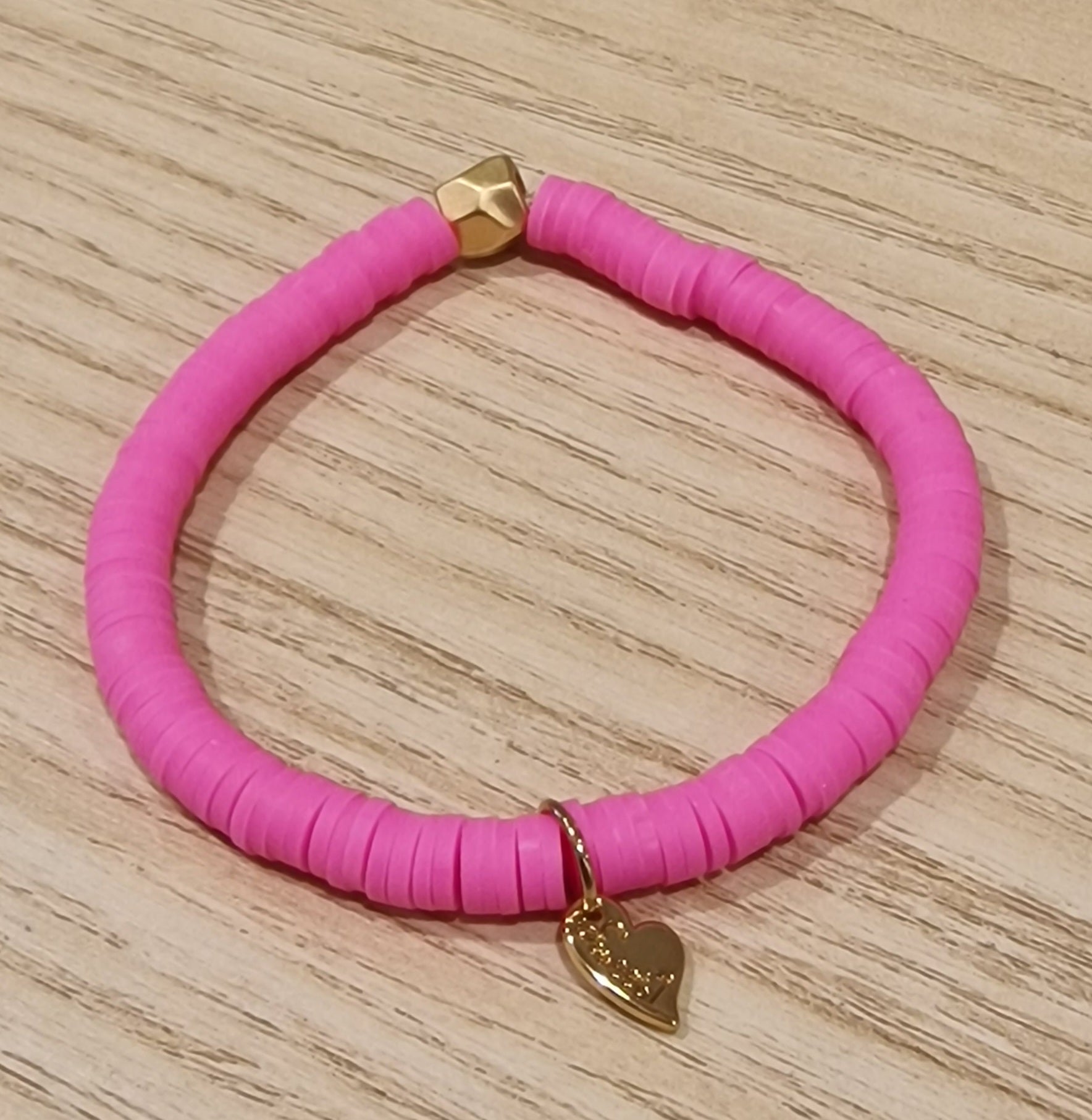 Bracelet élastiqué perles plates en polymère grandes - Rose Fluo