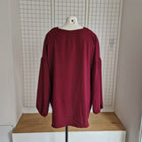 Tunique avec noeud et broche