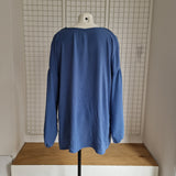 Tunique avec noeud et broche