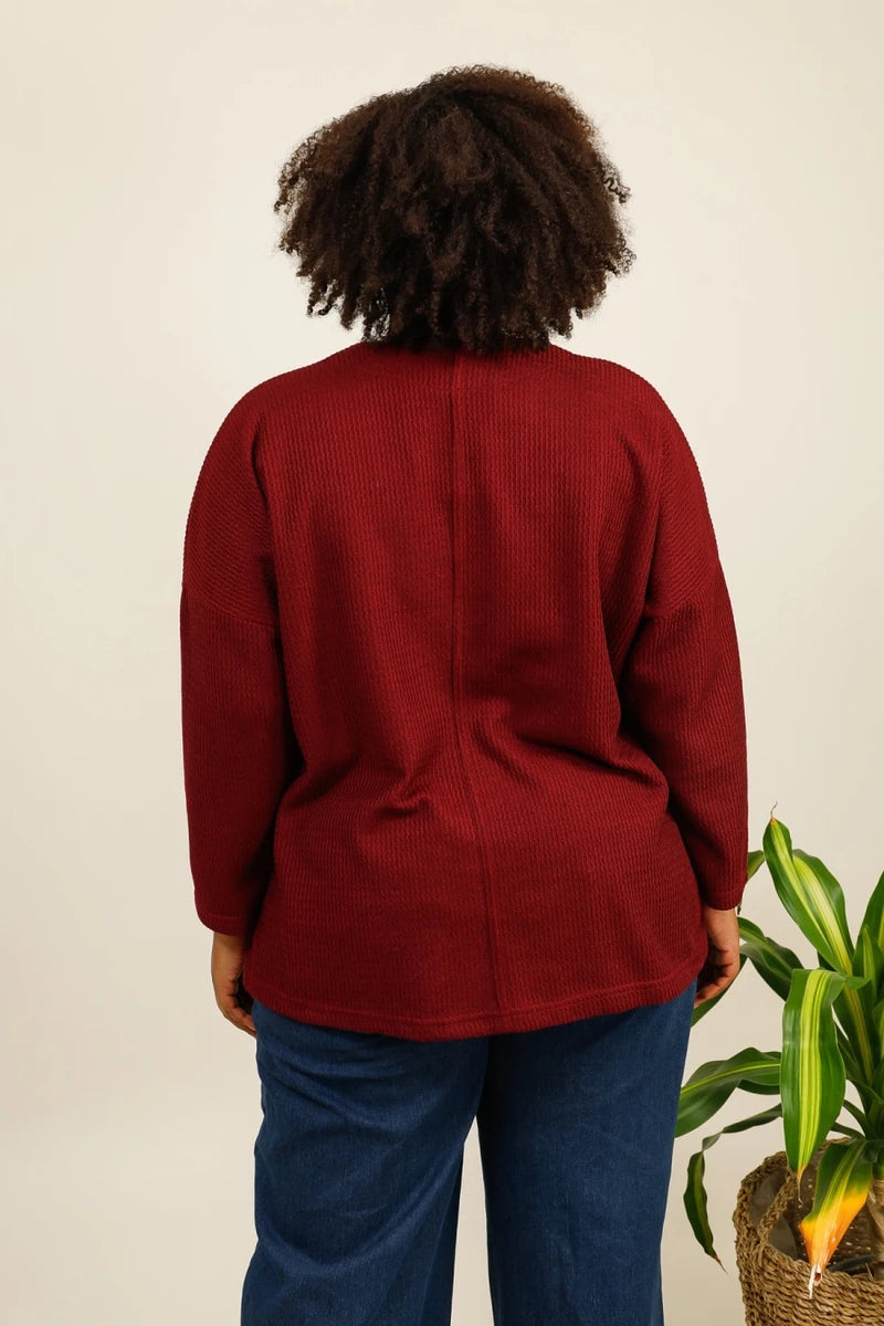 Pull bordeaux texturé avec poche en simili cuir
