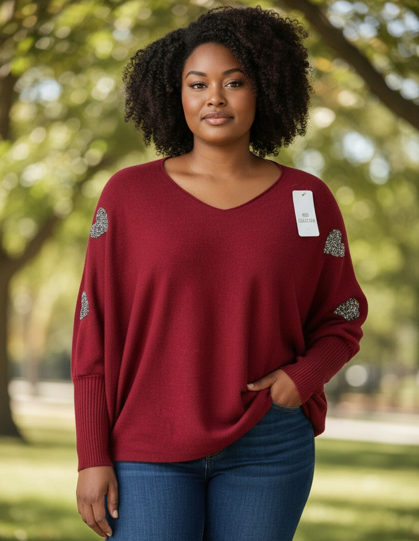 Pull oversize avec cœurs strass sur les manches